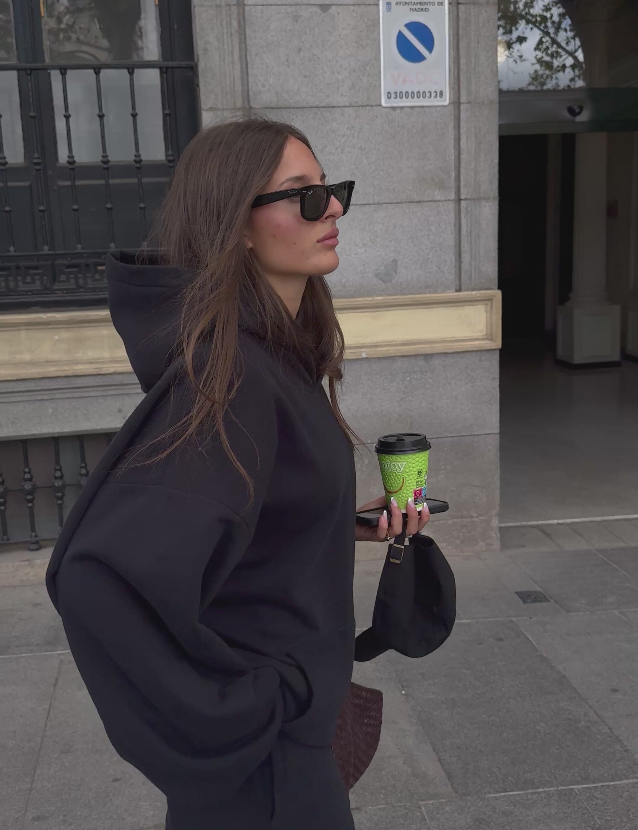 GIRL WEARING BLACK HOODIE